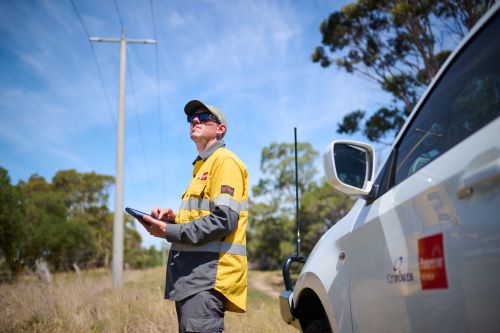 A crew member accessing private property to do inspection.